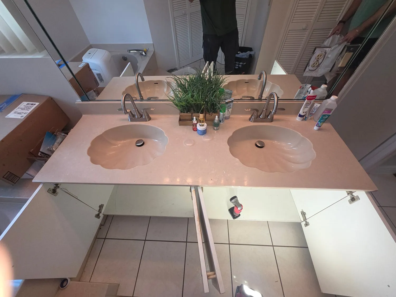 Double bathroom vanity with two newly installed faucets