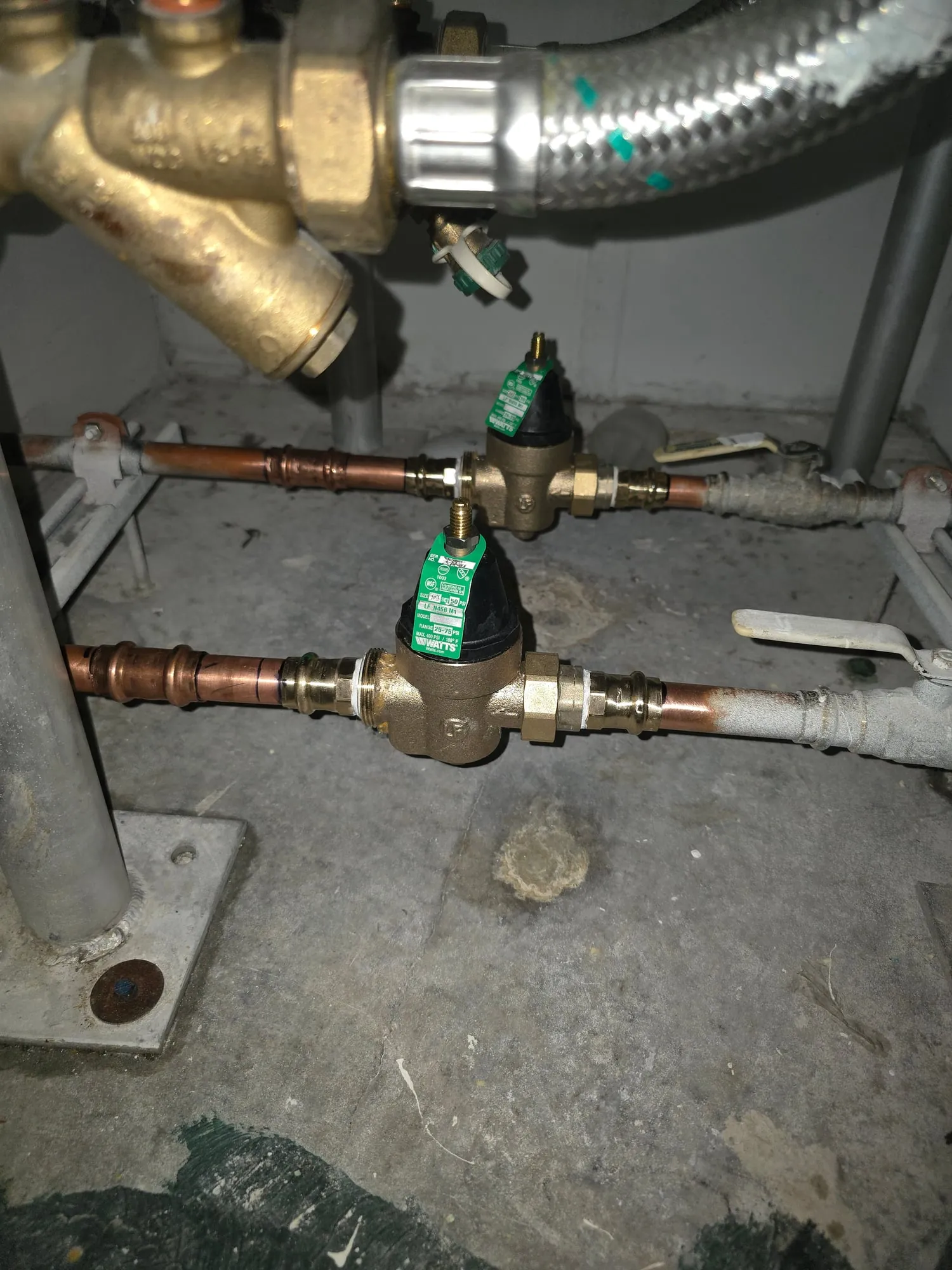 Replaced pressure-reducing valves under building equipment