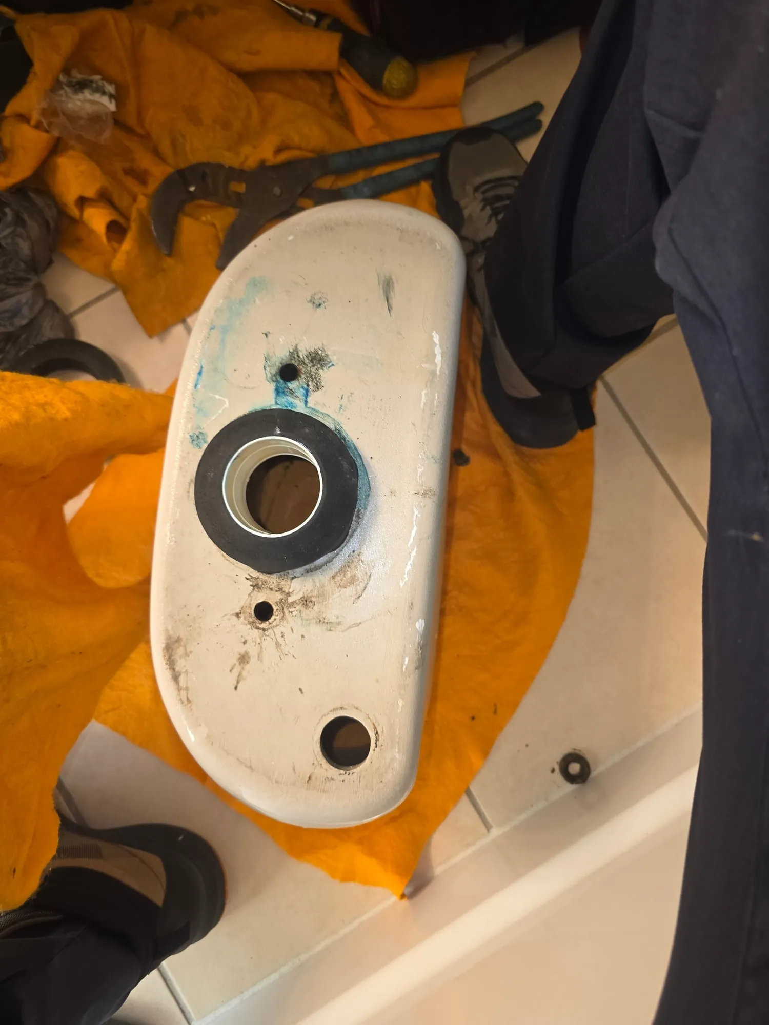 Toilet tank turned over with a new tank-to-bowl gasket